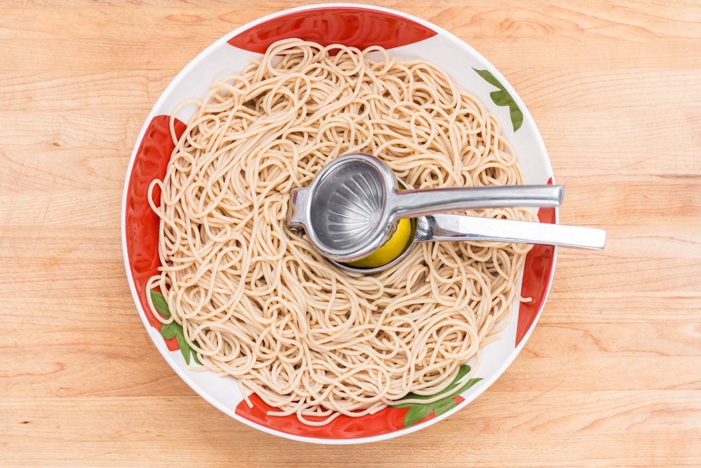 #8 Squeeze lemon juice on the noodles in the serving bowl.