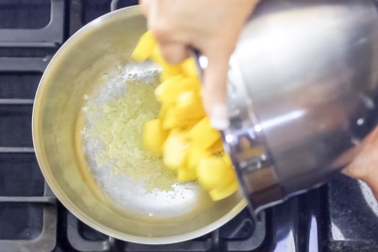 #11 Add the spiced potatoes to the pan.