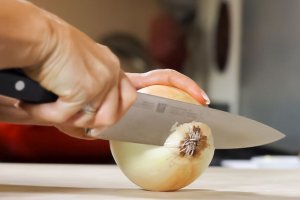 Henckels Professional Chef Knife Cutting an onion with the Henckels Professional Chef nife