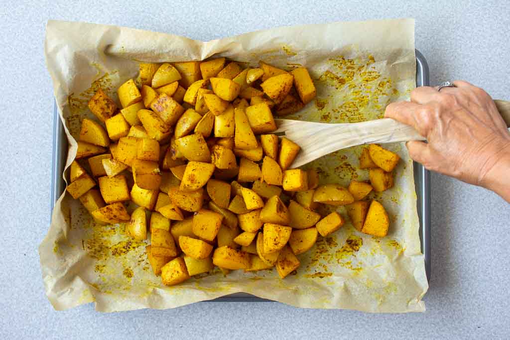 Flip the potatoes with a spatula